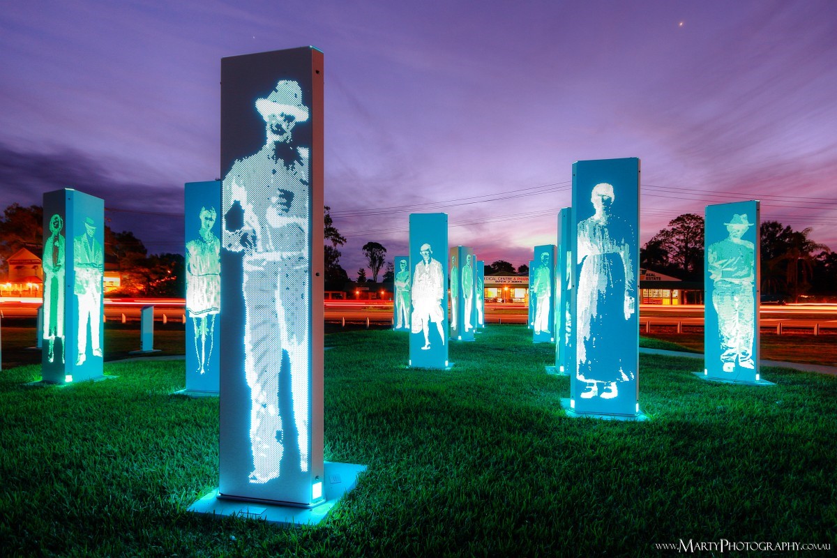 Forest of Memories public art installation features historic figures from Logan Village’s past and is illuminated from sunset to sunrise. Photograph by Marty Pouwelse.